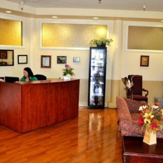 An office reception area with a desk and waiting space.