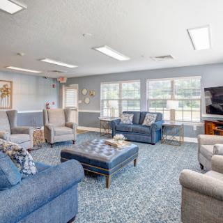 A cozy and inviting living room with ample seating options and natural light.
