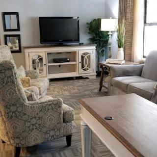 A cozy living room with comfortable seating and a television.