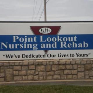 Sign for Point Lookout Nursing and Rehab with the slogan 'We've Dedicated Our Lives to Yours'.