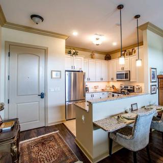 A cozy, modern kitchen and dining area in an open-plan apartment.