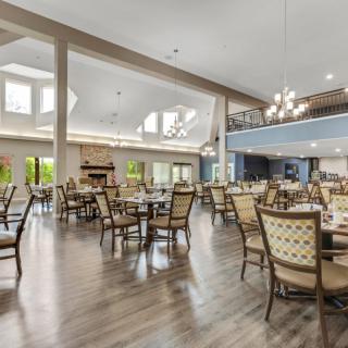 Spacious and elegantly designed dining area with ample seating and natural light.
