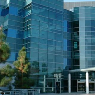 A modern office building with a glass facade.