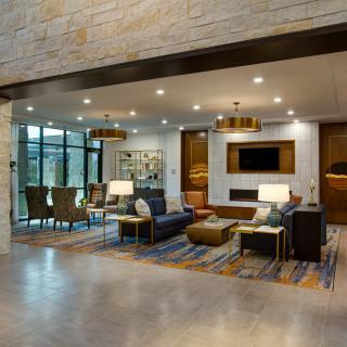 A modern living room with contemporary furniture and elegant lighting.