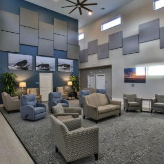 A modern lounge area with comfortable seating and decorative accents.