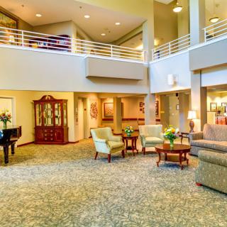 A spacious and elegantly designed lobby with comfortable seating and warm lighting.
