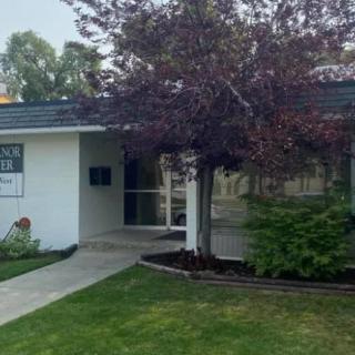 A modern house with a well-maintained lawn and garden.