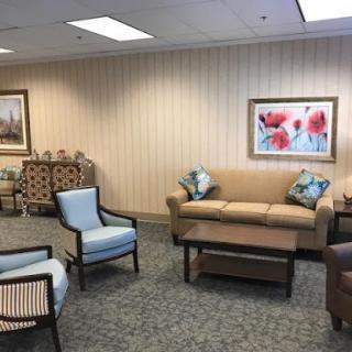 A cozy waiting area featuring a blend of stylish furniture and soothing decor.