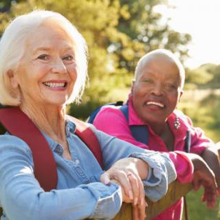 Two seniors enjoying a day of hiking in the outdoors.