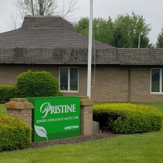 The exterior of a commercial building with a prominent sign displaying the name 'Gristine'.