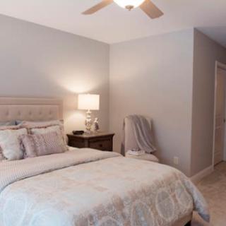 A modern bedroom with a comfortable bed and stylish decor.