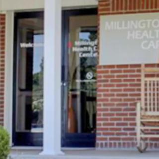 Entrance to a healthcare clinic with visible signage and glass doors.