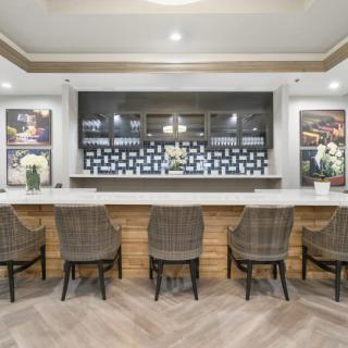 A modern bar interior with stylish seating and elegant decor.
