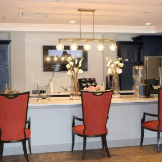 A modern bar area with elegant seating and stylish lighting.