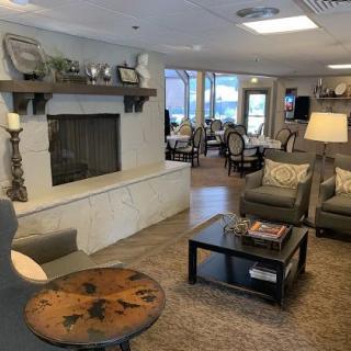 Cozy and inviting living room with a fireplace and comfortable seating.