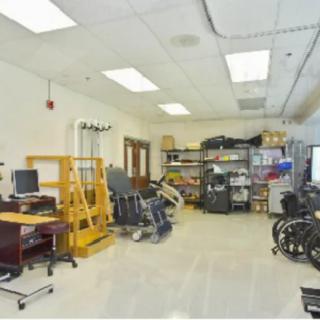 A medical office with rehabilitation equipment and wheelchairs.