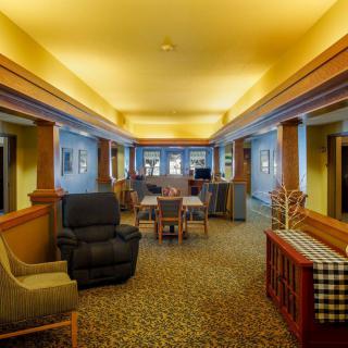 A cozy lounge area with comfortable seating and warm lighting.