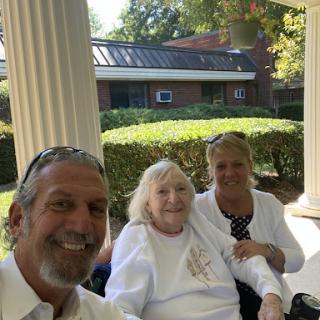 A joyful moment shared among family members outside.