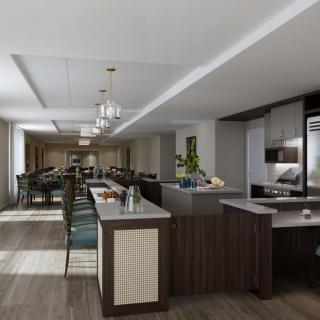 A modern kitchen and dining area with elegant chandeliers and ample seating.