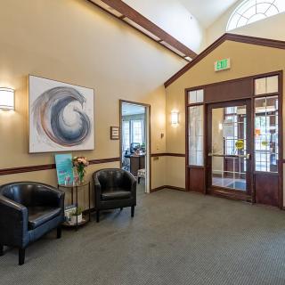 A welcoming lobby area with stylish chairs and modern artwork.
