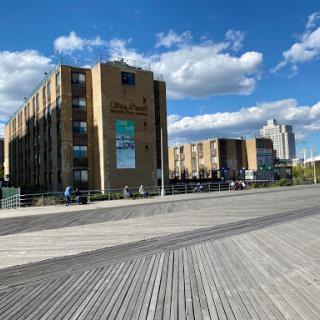A modern building complex under a bright sky, showcasing urban architecture.