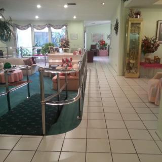 A vintage-style restaurant interior with neatly arranged tables and chairs.