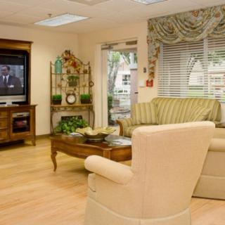 A cozy living room with comfortable seating and a television.