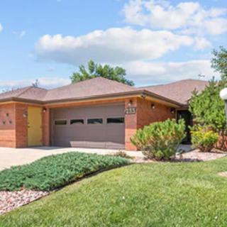 A suburban home with a well-maintained front yard and a two-car garage.