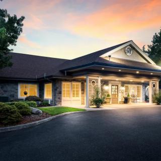 A welcoming building entrance illuminated during sunset.