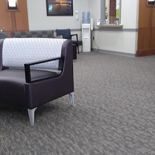 A modern waiting area featuring a stylish sofa.