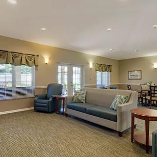 A cozy living room with comfortable seating and natural lighting.