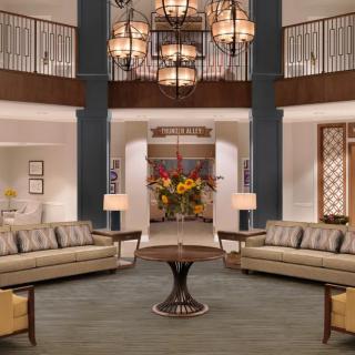 A modern lobby with elegant lighting and comfortable seating.
