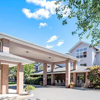 Front entrance of a residential building with a clear sky.