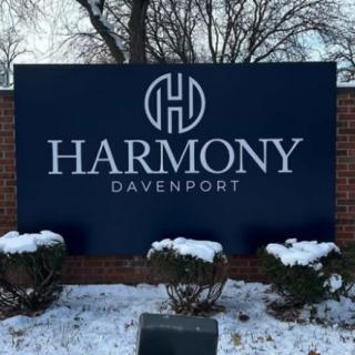 Sign for Harmony Davenport displayed outdoors in a snowy setting.