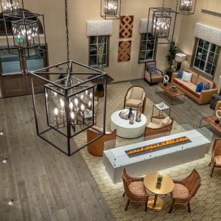 A modern lobby with stylish furniture and elegant lighting fixtures.