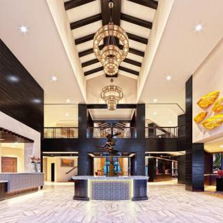A luxurious hotel lobby featuring modern design elements and a grand chandelier.