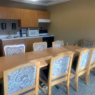 A cozy kitchen and dining area designed for casual meetings.