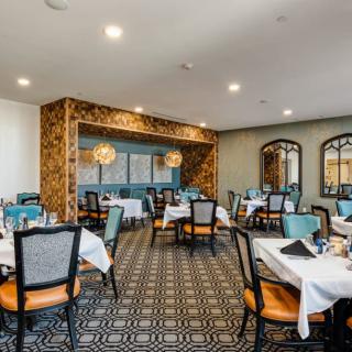 Elegant dining room with stylish decor and neatly arranged tables.