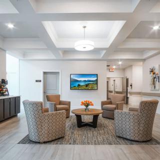 A modern lobby interior with a seating area and stylish decor.