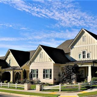 A charming suburban home under a clear blue sky.