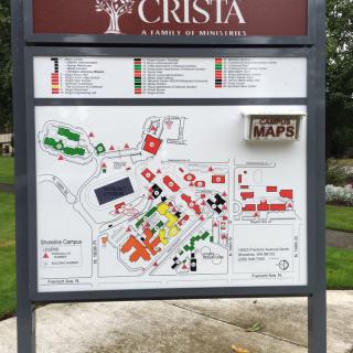 A campus directory map displayed on an outdoor information board for CRISTA.