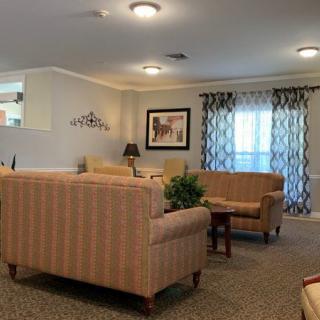 A cozy and well-decorated living room with sofas and a coffee table.