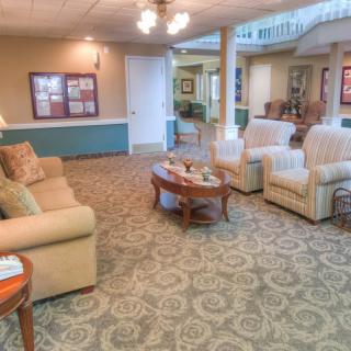 A cozy living room with comfortable seating and warm lighting.