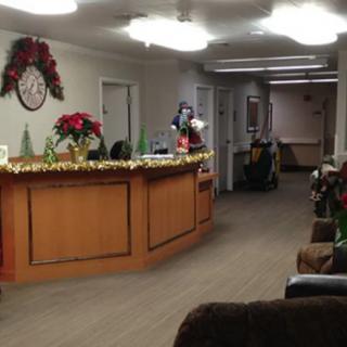A decorated reception desk with Christmas holiday decorations.