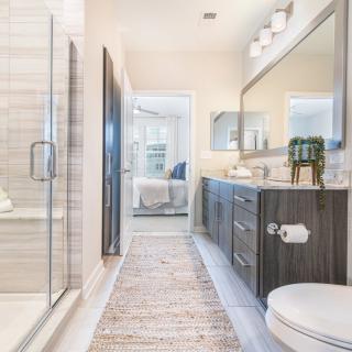 A modern bathroom with a glass shower enclosure and stylish vanity.