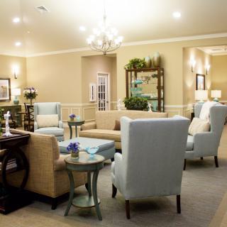 A cozy and elegantly designed living room with neutral-colored furniture and soft lighting.