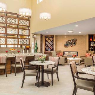 A modern lounge area with stylish furniture and elegant lighting.