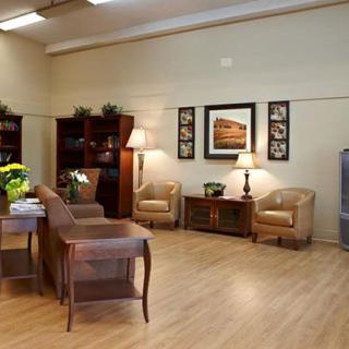 A cozy living room with comfortable seating and warm lighting.
