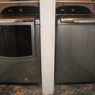 A washer and dryer set in a laundry room.
