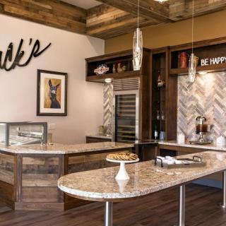 A modern kitchen interior with granite countertops and stylish decor.